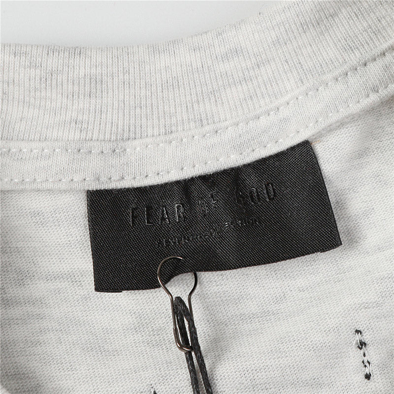Fear of God Flocked G Letter Pattern T-Shirt – Black / Light Grey / Apricot
